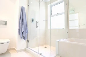 Modern bathroom shower showing glass front.