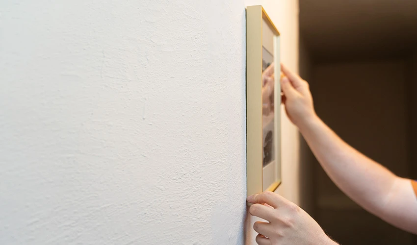 How to Hang Pictures on Plaster Walls