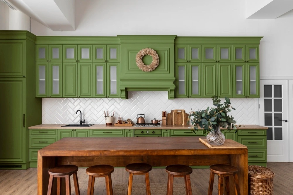 Bright green kitchen cabinets in kitchen.